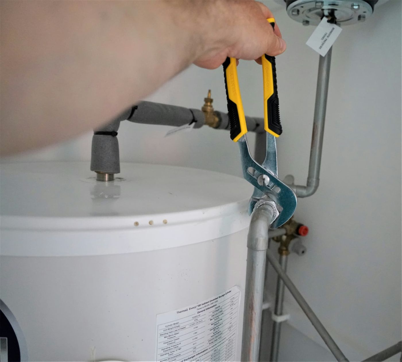 Hot water cylinder being fitted